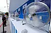 A person rests in front of cooling fans installed in central Seoul on Aug. 4.