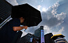 A person holds an umbrella to protect themselves from strong sunlight in central Seoul on Aug. 4.