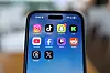 Instagram, TikTok, Snapchat, Kick, YouTube, Facebook, Twitch, Reddit, Threads and X applications are displayed on a mobile phone in this picture illustration taken on Dec. 9, 2025.