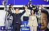 Then-President elect Lee Jae Myung, left, and his wife Kim Hea Kyung stand to congratulate the victory in the presidential election in Yeouido, western Seoul, in June 2025.