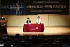 Press briefing on a stage with a banner for the 2026 Swan Lake production at Seoul Arts Center.