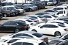 Used cars for sale are parked in Seoul on Feb. 18.