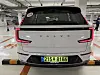 The rear of the Volvo EX90. The taillights stretch from the pillars down both edges of the rear glass to the trunk to enhance safety.