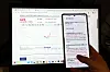 A mobile device shows instructions before purchasing exchange-traded funds for chip stocks on July 30.