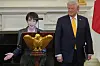 Japanese Prime Minister Sanae Takaichi, left, speaks during a dinner with U.S. President Donald Trump in the State Dining Room of the White House in Washington on March 19.