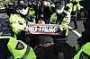 Police officers arrest an anti-Donald Trump protester near the meeting venue of U.S. President Trump and Korean President Lee Jae Myung during a rally against Trump's visit to attend the Asia-Pacific Economic Cooperation (APEC) forum in Gyeongju on Oct. 29, 2025