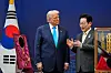 Korean President Lee Jae Myung, right, presents, an award of the Grand Order of Mugunghwa to U.S. President Donald Trump at the Gyeongju National Museum in Gyeongju on Oct. 29, 2025.