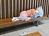 A homeless person rests on a bench at Incheon International Airport's passenger terminal in an undated photo.