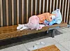 A homeless person rests on a bench at Incheon International Airport's passenger terminal in an undated photo.