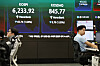 A screen in Hana Bank's trading room in central Seoul shows the Kospi opening on Aug. 11.