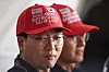 People wear hats as they wait for Korean President Lee Jae Myung to arrive at the Hanwha Philly Shipyard in Philadelphia for a ceremony on Aug. 26, 2025.