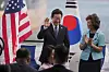 Korean President Lee Jae Myung, left, arrives at the Hanwha Philly Shipyard for a ceremony on Aug. 26 in Philadelphia.