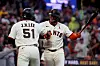 San Francisco Giants' Jung Hoo Lee (51) is congratulated by Willy Adames, right, after hitting a solo home run against the Houston Astros during the fifth inning of a baseball game in San Francisco, Monday, Aug. 10, 2026. (AP Photo/Jed Jacobsohn)/2026-08-11 12:18:50/