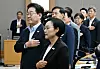 President Lee Jae Myung, second from front, salutes the national flag during a Cabinet meeting held at the Sejong Government Complex in the Chungcheong region on Aug. 11.