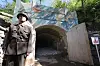 A North Korean official guards an entrance to the Punggye-ri underground nuclear test site in North Hamgyong Province in May 2018.