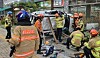 Fire fighters respond to a scene where Kia Seltos fell from a rooftop parking lot of a grocery supermarket in Suwon, Gyeonggi, on Aug. 12.