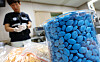 Illegally produced Viagra pills are seen in a glass jar at a state-run food safety institution in western Seoul on June 4, 2024.