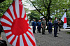 Visitors carry Japanese flags and a rising sun flag at Yasukuni Shrineon in Tokyo on Aug. 15.