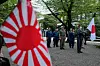 Visitors carry Japanese flags and a rising sun flag at Yasukuni Shrineon in Tokyo on Aug. 15.