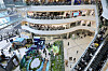 Crowds gather around a colorful installation in the atrium of Times Square mall in Seoul.