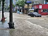 Road in Geoje is seen flooded on Aug. 17.