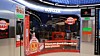 Mars-branded promotional kiosk with product displays and electronic machines.