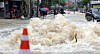 A road in Okpo-dong, Geoje, South Gyeongsang, is flooded following torrential rain on Aug. 17.
