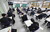 Students participate in a state-wide mock exam for the College Scholastic Ability Test (CSAT) held in a high school in Songpa District, southern Seoul, on June 4.