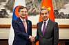 Korean Foreign Minister Cho Hyun, left, shakes hands with his Chinese counterpart Wang Yi in Beijing, China, on Sept. 17.