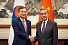 Korean Foreign Minister Cho Hyun, left, shakes hands with his Chinese counterpart Wang Yi in Beijing, China, on Sept. 17.
