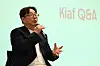 Jung Gu-ho speaks into a microphone beside a projected “Kiaf Q&A” title.