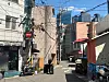 재사용금지!!!!!!!! A foreign tourists pull suitcases through an alley in Seogye-dong, Yongsan District, central Seoul, on Aug. 12.