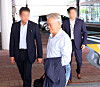 Former President Moon Jae-in arrives at Gimhae International Airport to depart to Mongolia on Aug. 23. 2026