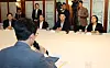 Kim Min-seok, the leader of ruling Democratic Party, bottom, speaks during the meeting between the government and the party held in central Seoul on Aug. 23.