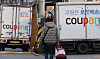 Coupang trucks are parked near the e-commerce platform's logistics center in Seoul on Dec. 29, 2025.