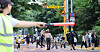 Adults guide students on their way home from school outside in Dongdaemun District, eastern Seoul, on May 12.