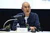 Seo Do-ho sits at a table with microphones and answers questions at an art exhibition press briefing.