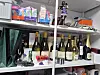 Bottles of wine are placed on a shelf where the 35-year-old suspect resided.