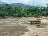 A damaged house is submerged in flooded water in Nepal on Aug. 26.
