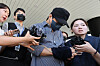 A police officer surnamed Bu, who was accused of falsely closing multiple missing persons cases, leaves the Jeju District Court on Aug. 25.