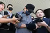 A police officer surnamed Bu, who was accused of falsely closing multiple missing persons cases, leaves the Jeju District Court on Aug. 25.