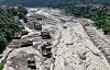 Houses lie partially submerged in muddy water along a riverside after flash floods at Trishuli Bazar in Nepal's Nuwakot district on August 26.