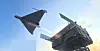 Two military aircraft viewed from below against a bright blue sky.
