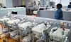 Nurses take care of newborn babies at a hospital in Gyeonggi on June 24.