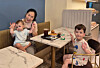 Lee Saem-na, center, and her two children in a photo taken at a cafe in August.