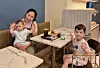 Lee Saem-na, center, and her two children in a photo taken at a cafe in August.