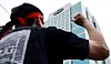 A worker participate in a labor action in front of Hyundai Motor's headquarters in Seocho District, southern Seoul, on Aug. 21.