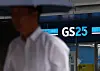 A person walks in front of GS25 store in Seoul on Aug. 31.