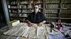 Palestinian manuscript scholar Abdul Latif Abu Hashim works to preserve an ancient manuscript.
