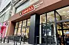 Chipotle Mexican Grill storefront with outdoor seating and glass entrance